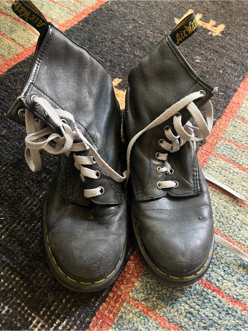 Dr. Martens Black Leather Boots with Gray Laces
